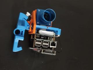 The camera and raspberry pi and cramped interior circuit board of the pifinder