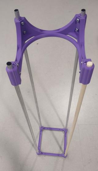 one dowel and four aluminum rods making a frame