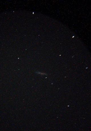 A picture of the galaxy M82, taken using my smartphone. It's much noisier and grainier than the DSLR.