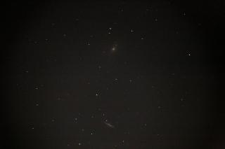 A picture of M81 and M82 galaxies, white smudges in a field of stars. Taken via pingu camera.