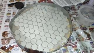 I poured epoxy over my old tool to ensure any coarse scratch-producing grit stays trapped in the tool, then covered it with a new layer of tiles.