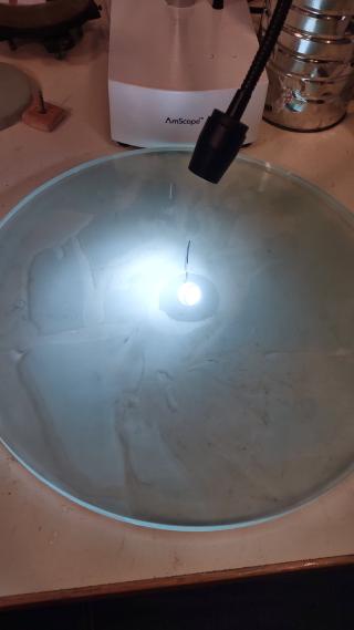 Mirror by eye. Looks reflective! It has a sharpie line drawn on it.