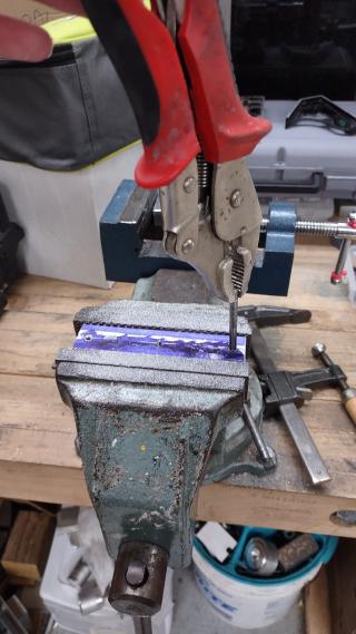I drilled then tapped holes into the aluminum so I could insert nylon screws. That way the mirror rests on soft nylon instead of scratchy metal or wood.